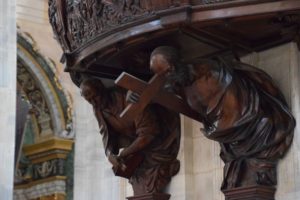 Duomo di Pavia - detail from the pulpit - carved wooden images of saints