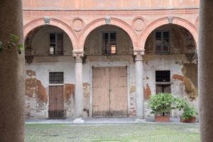 Pavia, door inside the courtyard of the 15th century Palazzo Orlandi